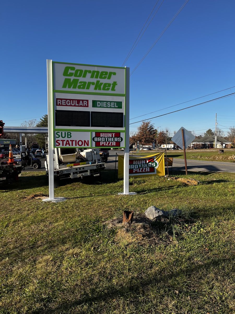 Corner Market illuminated pylon sign