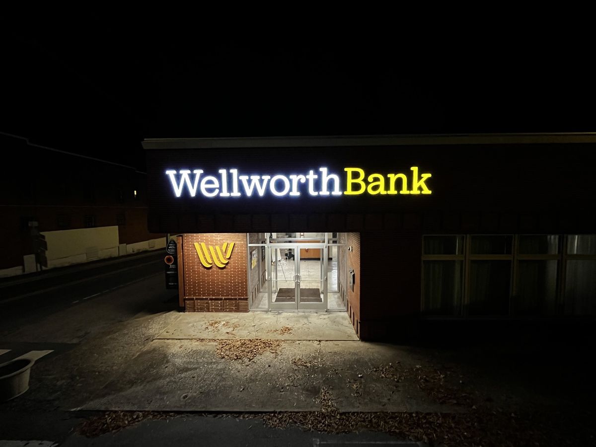 Illuminated bank channel letters at night